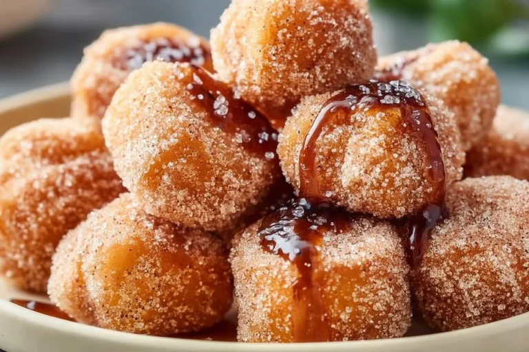 Healthy air fryer churro bites served on a plate with cinnamon sugar